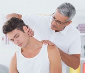 Coral Springs Chiropractor first visit chiropractor looks at patient neck